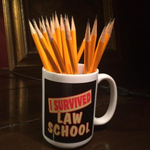 Novelty law school mug full of pencils.